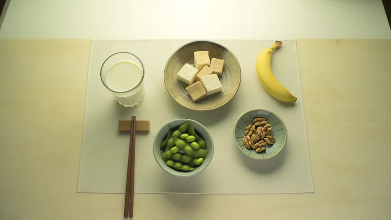 睡眠の質を高める食材の俯瞰写真。豆腐・枝豆・バナナ・温かいミルク・くるみを和食器に盛り、箸を添えた日本的な食卓
